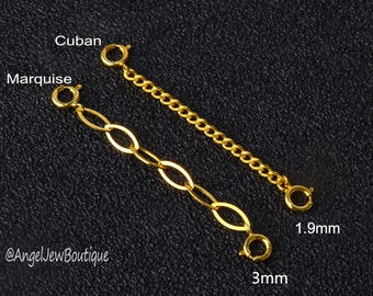 May include: Two gold chain extenders, one with a Cuban link style and one with a marquise link style. The Cuban link extender is 1.9 mm wide and the marquise link extender is 3 mm wide.
