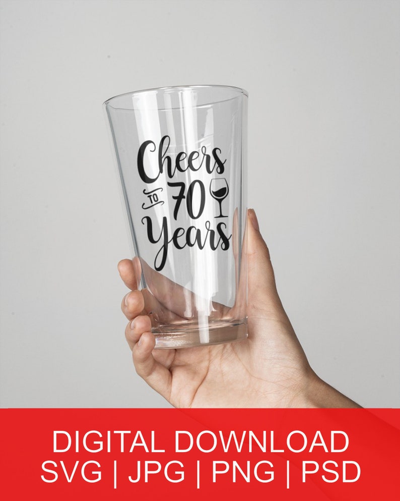 May include: A clear glass with a black vinyl decal that says "Cheers to 70 Years" with a wine glass icon.