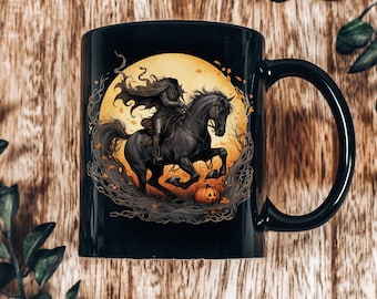 May include: Black ceramic mug with a graphic of a rider on a black horse galloping through a forest with a jack-o-lantern in the foreground. The background is a yellow moon with falling leaves.