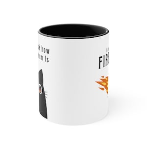 A white ceramic mug with a flaming D20 on it for dungeons and dragons DnD that says I didnt ask how big the room is on one side and I said I cast FIREBALL on the other