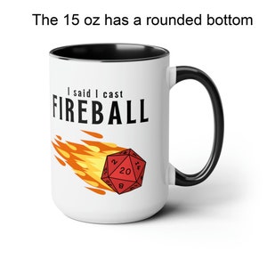 A white ceramic mug with a flaming D20 on it for dungeons and dragons DnD that says I didnt ask how big the room is on one side and I said I cast FIREBALL on the other