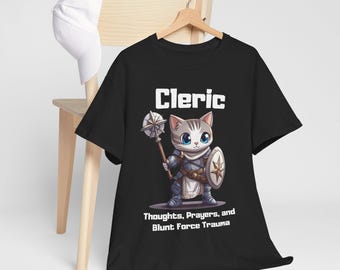 May include: Black t-shirt featuring a cartoon cat dressed as a cleric, holding a mace and shield. The shirt has the word "Cleric" above the cat and the phrase "Thoughts, Prayers, and Blunt Force Trauma" below.