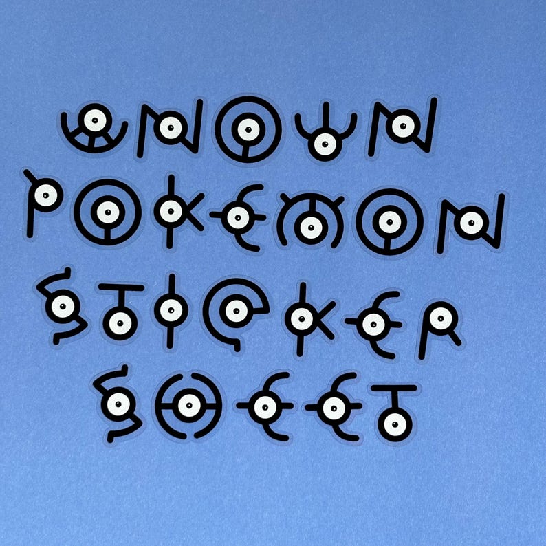 May include: A collection of 26 black and white stickers featuring the Pokemon character,  'Know'. Each sticker is a different letter of the alphabet, forming the word 'Pokemon'.