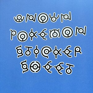 May include: A set of 20 black and white Pokemon symbols on a blue background. The symbols are arranged in three rows. The symbols are all different and represent different Pokemon.