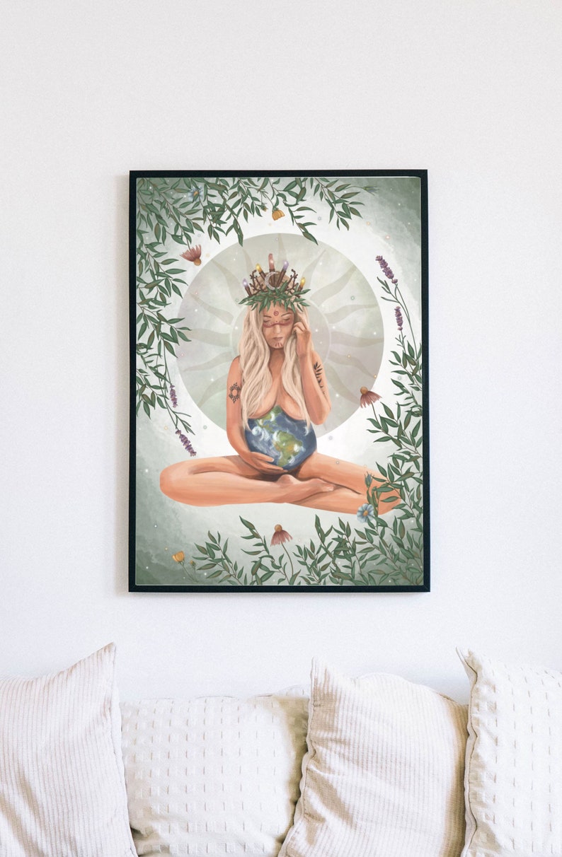 May include: A digital illustration of a woman with long blonde hair wearing a crown of leaves and flowers. She is sitting in a lotus position with her hands holding a globe of the Earth. The background is a soft green with leaves and flowers.