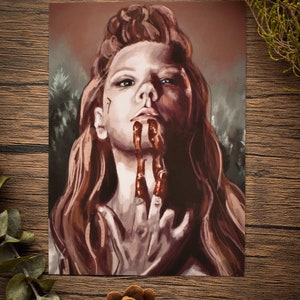 May include: A painting of a woman with long red hair, wearing a dark brown outfit. Her face is painted with a red, bloody design, and her hands are covered in blood.