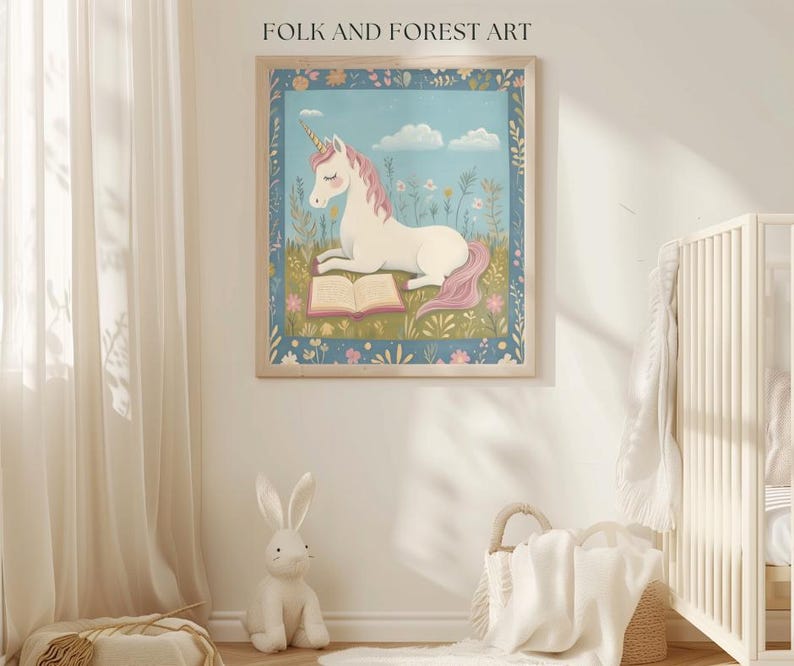 May include: A framed art print featuring a white unicorn with a pink mane and tail, reading a book in a field of flowers. The artwork has a blue border and is labeled "FOLK AND FOREST ART" at the top.