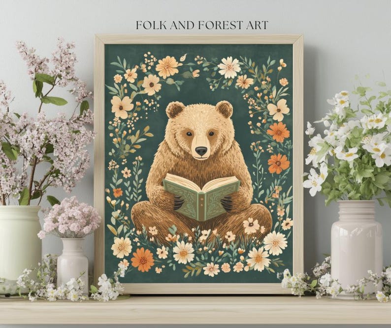 A cozy folk art illustration featuring a brown bear sitting among wildflowers, holding an ornate green book. The green background complements the warm tones of the bear and florals. Perfect for book lovers, woodland nursery decor, and cottagecore.