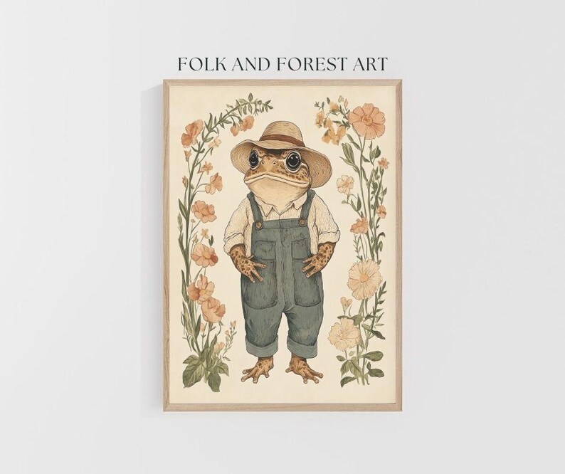 May include: A watercolor illustration of a toad wearing a straw hat and overalls standing in a field of flowers. The toad is brown with green eyes and a wide smile. The flowers are pink and white.