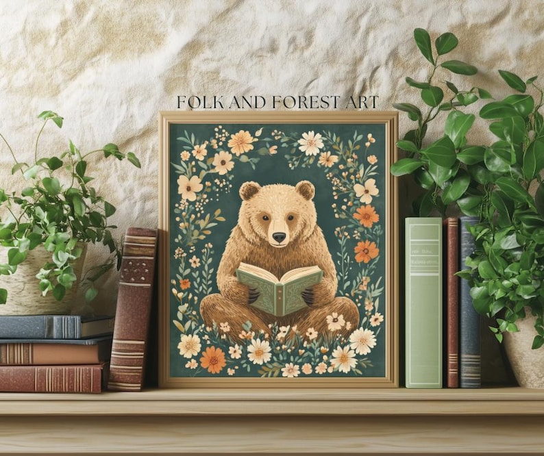 A cozy folk art illustration featuring a brown bear sitting among wildflowers, holding an ornate green book. The green background complements the warm tones of the bear and florals. Perfect for book lovers, woodland nursery decor, and cottagecore.