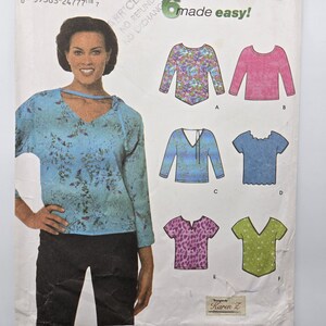 May include: A woman wearing a blue patterned top with a V-neck. The image also shows a sewing pattern with six different top designs, including long and short sleeves, and various necklines. The text "made easy!" is visible.