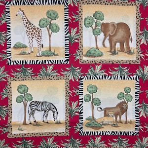 May include: A fabric panel featuring four square illustrations of African animals. Each square has a different animal: a giraffe, elephant, zebra, and lion with a lioness. The background is red with a jungle-themed pattern.