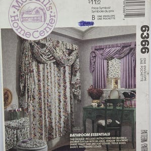 May include: A McCall's Home Center sewing pattern envelope 6366 for bathroom essentials. The cover displays a shower curtain with a floral valance, a window treatment with purple gingham curtains, and matching covers for a toilet tank and seat.