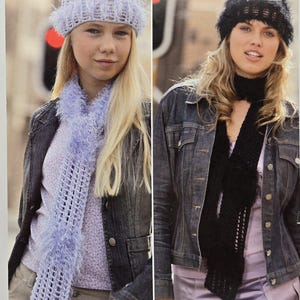 May include: Image of a knitting pattern booklet featuring two women wearing knitted accessories. The woman on the left wears a light blue hat and scarf, while the woman on the right wears a black hat and scarf. The booklet's text includes "TUFTY" and "SIRDAR".
