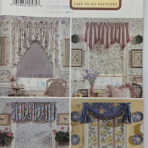 May include: A Butterick pattern featuring various Waverly curtain designs. The image showcases different styles, including valances and ruffled curtains, with floral and patterned fabrics. The text "At Home With Waverly" is visible.