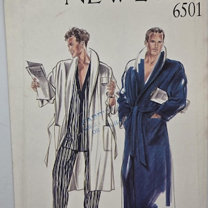 May include: New Look 6501 sewing pattern envelope featuring illustrations of two robe styles. One shows a white robe over striped pajamas, the other a solid dark blue robe. Both feature shawl collars, tie belts, and patch pockets.