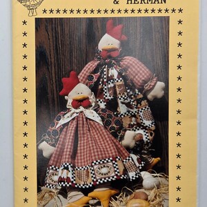 May include: A vintage pattern cover featuring two whimsical 45 cm chicken dolls named "Henrietta & Herman." The dolls are dressed in patterned fabrics with red combs and yellow feet. The cover is yellow with star accents.