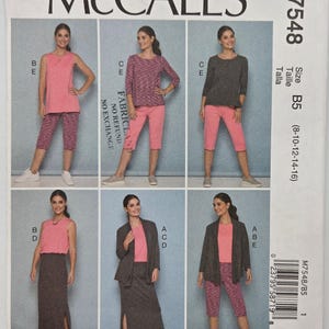 May include: McCall's M7548 sewing pattern envelope featuring six variations of tops, trousers, and skirts. The images display sleeveless and long-sleeve tops in pink and grey, paired with capri trousers and long skirts. Includes size range B5 8-16.