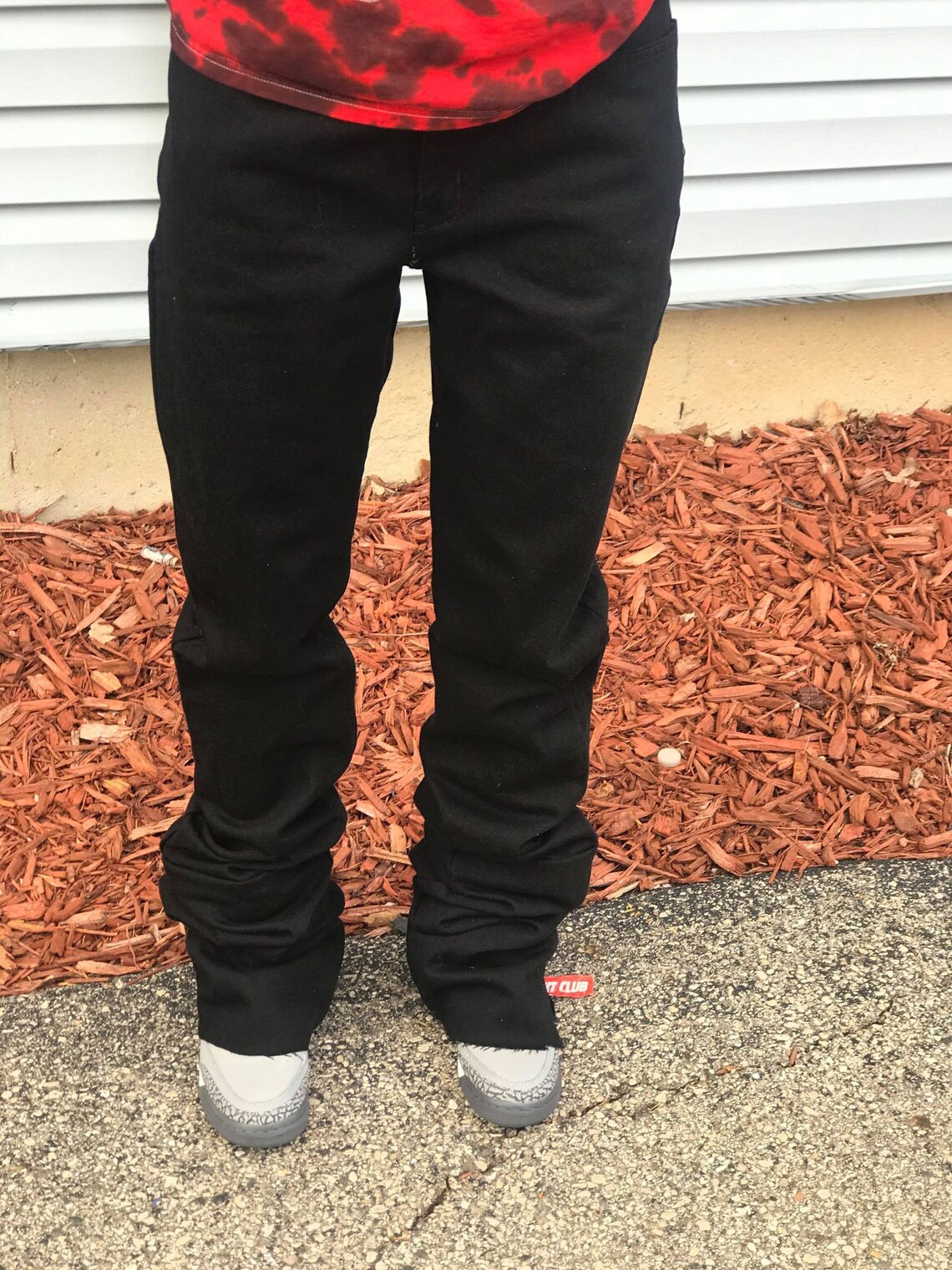 black stacked ripped jeans