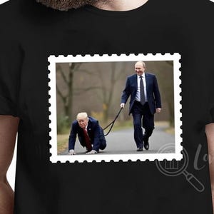 May include: A black t-shirt with a white stamp-like image of two men walking. The man in the front is on his hands and knees, while the man behind him is holding a leash attached to the front man's collar. The text "Love is Love" is visible in the bottom right corner of the image.