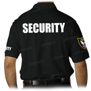 May include: Black polo shirt with the word "SECURITY" in large white letters across the back. The left sleeve has the word "ITY" in white. A security officer patch is on the right sleeve.