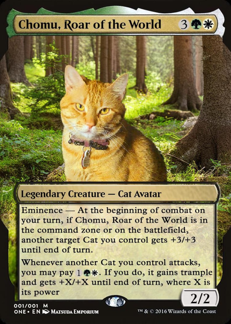May include: A Magic: The Gathering card featuring a ginger cat with a pink collar and a tag. The card is titled "Chomu, Roar of the World" and has a power and toughness of 2/2. The card text describes the cat's abilities in the game.