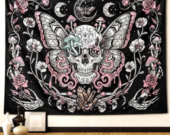 May include: Black tapestry featuring a skull with butterfly wings, mushrooms, and floral elements in pink and white. The design includes crescent moons, a moth, and skeletal hands. A decorative piece for wall decor.