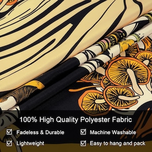 May include: A folded tapestry with a black, yellow, and orange mushroom design. The fabric is 100% high-quality polyester, fadeless, durable, lightweight, machine washable, and easy to hang and pack.