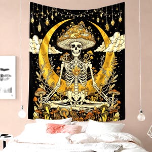 May include: A black tapestry featuring a skeleton meditating in front of a golden crescent moon. The skeleton wears a mushroom cap and is surrounded by mushrooms. The background is a starry night with hanging lights and crystals.