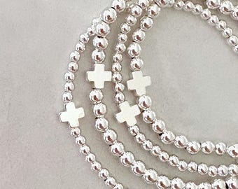 de kenmerkende zilveren kruiscollectie | zilveren kruisarmband | Gekruiste kralenarmband | trouwarmband | religieuze armband
