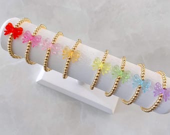 the bow bracelet | bow charm bracelet | charm bracelet | beaded bracelet | stacking bracelet | 14k gold plated bracelet | stretch bracelet