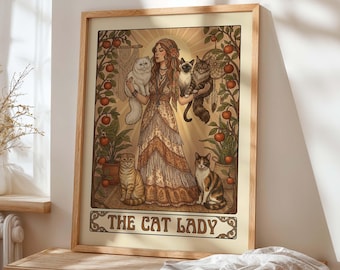 May include: A framed art print featuring a woman surrounded by cats, with the text "THE CAT LADY" at the bottom. The artwork has a vintage style with warm colors, depicting the woman holding several cats. Decorative elements include plants and a sunburst.