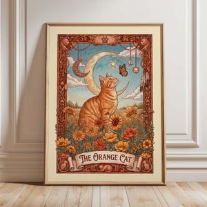 May include: Framed art print featuring an orange tabby cat gazing at a butterfly near a crescent moon and star. The artwork is set in a field of flowers with a banner that reads "The Orange Cat". The frame is a warm brown color.