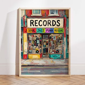 May include: A framed art print depicting a record shop with the word "RECORDS" above the entrance. The shop front is painted in bright colours, with the genres "SOUL JAZZ FUNK REGGAE" displayed. Vinyl records are visible in the windows.