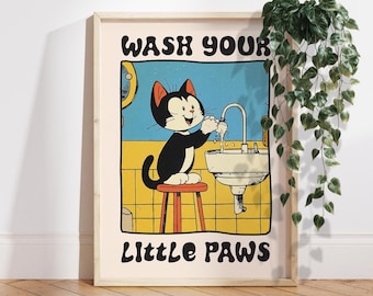 May include: A cartoon cat with black fur and white markings washes its paws in a bathroom sink. The text "WASH YOUR LITTLE PAWS" is printed on the poster.