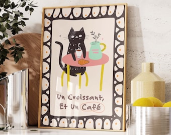 May include: A black cat sits at a table with a croissant and a cup of coffee. The text on the poster reads "Un Croissant, Et Un Café".