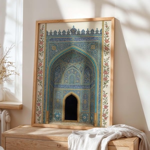 May include: Framed art print featuring a detailed illustration of an arched alcove with intricate blue and gold patterns. The artwork is framed in a light wood frame and adorned with floral accents. The overall theme is decorative art.
