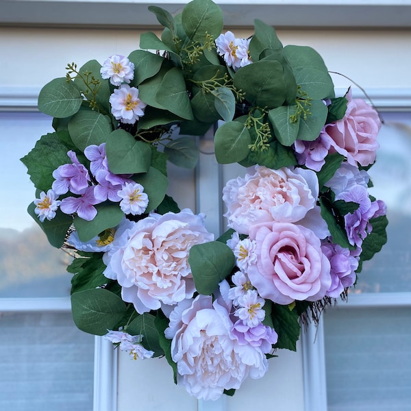 Beautiful faux wreath with purple and lavender tones perfect for the winter/spring. Wreath for front door decor.