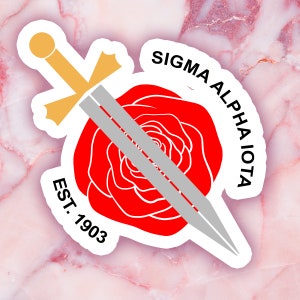 May include: A sticker featuring a red rose with a silver sword overlay. The text "SIGMA ALPHA IOTA" arches above the rose, and "EST. 1903" is below. The sword has a gold hilt.