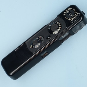 MINOX B with built in  coupled exposure meter and Flash Unit