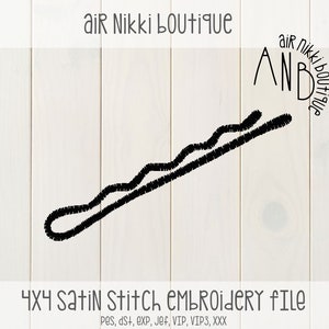 May include: Black and white embroidery design of a hair clip, 4x4 satin stitch embroidery file.  The design is labeled "AND" with the text "air nikki boutique" around it.