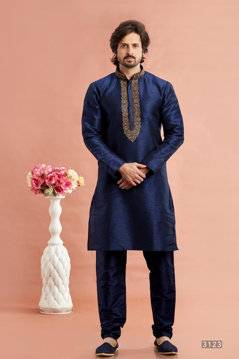 May include: A navy blue kurta pajama set. The long-sleeved kurta features intricate gold embroidery around the collar. The matching pajama pants complete the traditional Indian outfit. The number "3123" is visible in the bottom right corner.