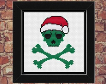 May include: A green skull wearing a red Santa hat with white trim, and crossed green bones. The skull has black eyes and a black nose.