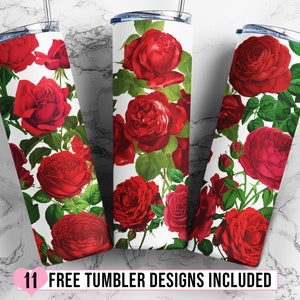 May include: Three white tumblers with a red rose floral pattern. The tumblers are on a white marble surface.