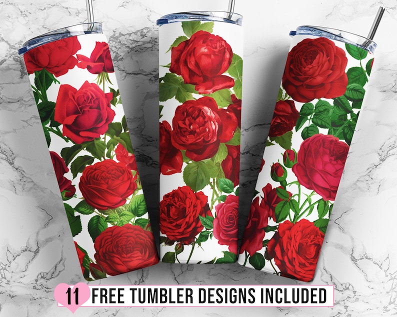 May include: Three white tumblers with a red rose floral pattern. The tumblers are on a white marble surface.