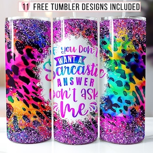 May include: Three stainless steel tumblers with a purple glitter finish. The center tumbler has a white background with the text "If you don't want a sarcastic answer don't ask me". The tumblers have a colorful abstract design with leopard print.