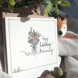 Tarjeta floral de feliz aniversario de bodas