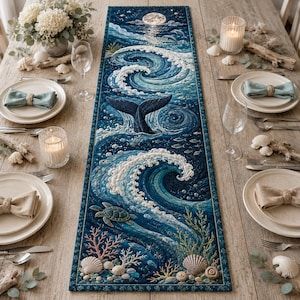 May include: A rectangular table runner featuring a detailed ocean scene with a whale tail, crashing waves, a sea turtle, coral, and seashells. The design includes a night sky with a full moon, dolphins, and schools of fish in shades of blue.