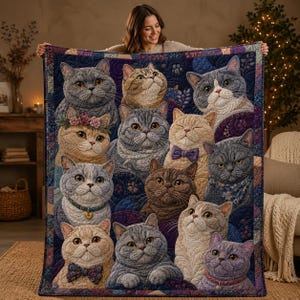 May include: A rectangular quilt featuring a collage of various cat portraits in shades of grey, brown, and cream. The cats are depicted with detailed fur textures, some wearing accessories like floral crowns, bow ties, collars, and patterned bandanas.