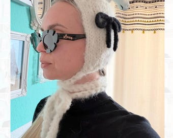 Fluffy knitted bonnet for women – soft winter hat with bows